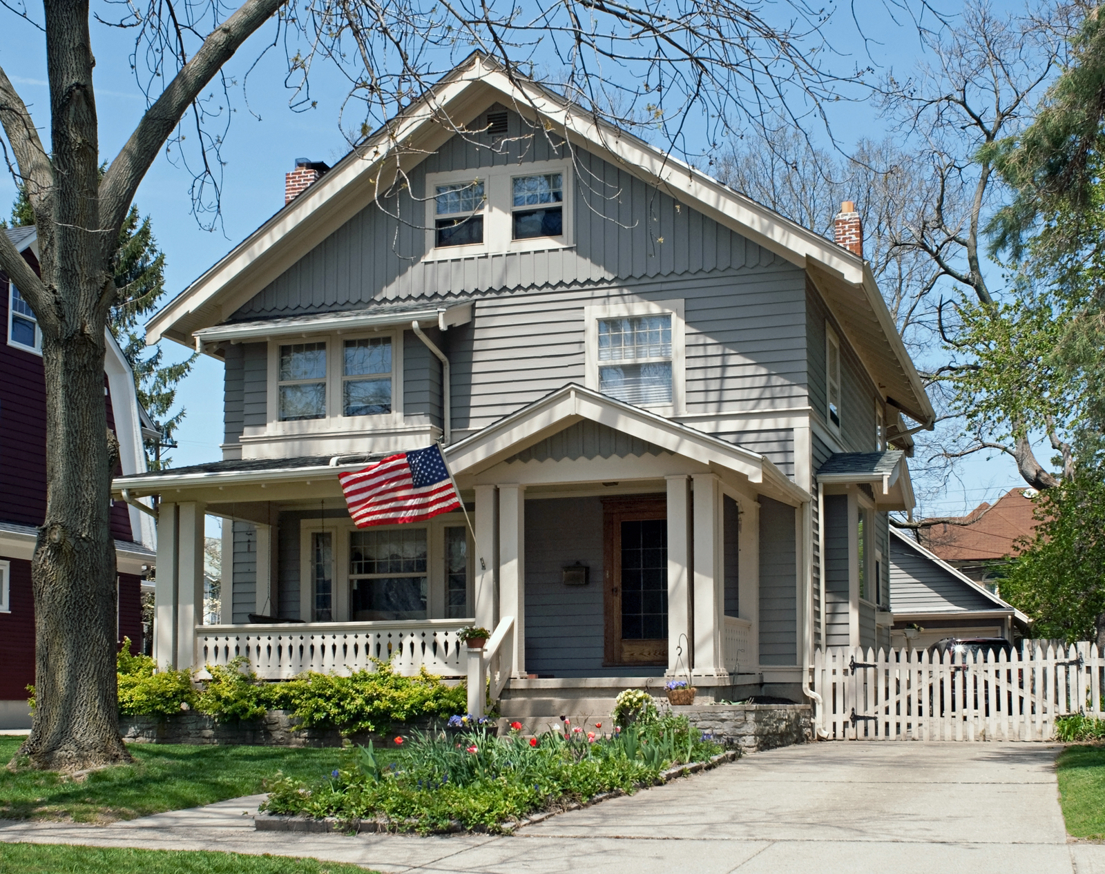 Classic American home with porch and flag in Palatine, Illinois
